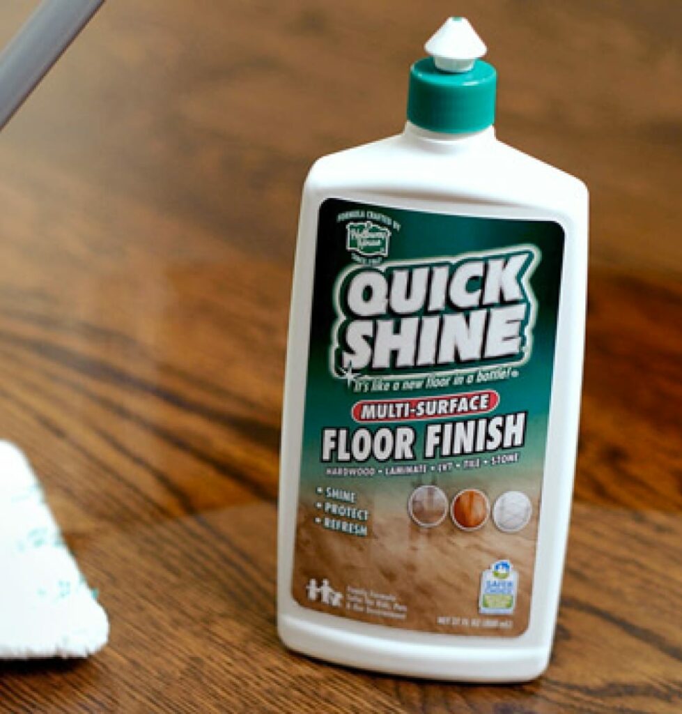 Quick Shine® Floor Finish bottle sitting on wood floor