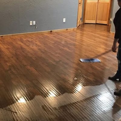 A customer applying Quick Shine&reg products to wood floor