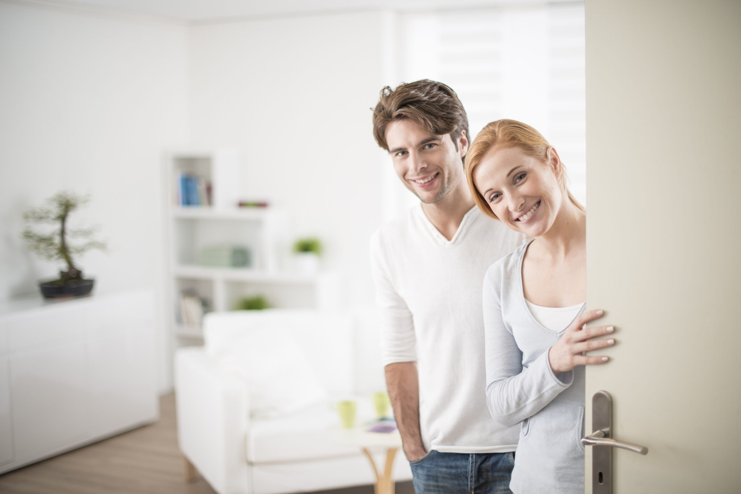 bigstock A Cheerful Couple Inviting Peo 225592048