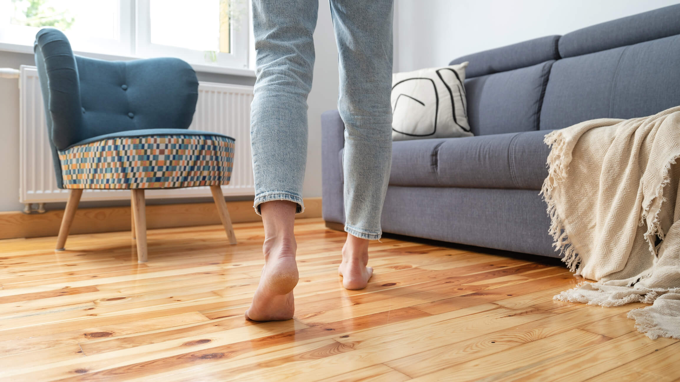 lady walking on hardwood floor